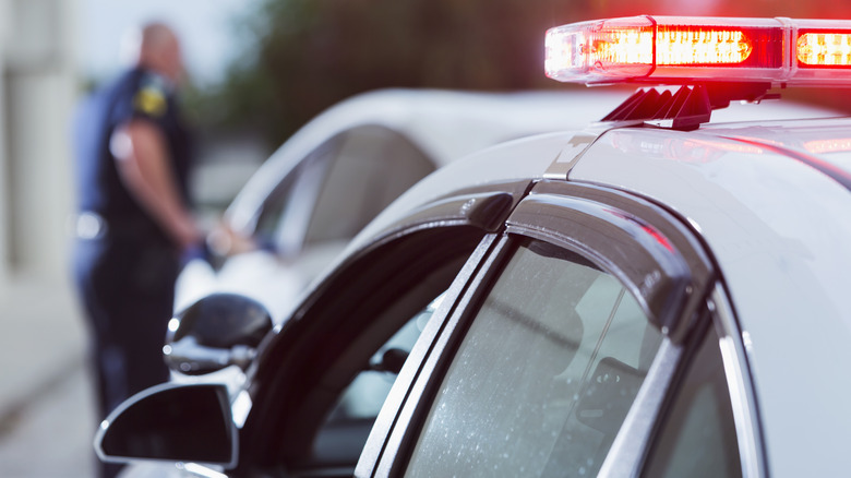 A police officer pulling a driver over.