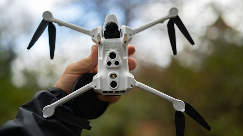 The Antigravity A1 held in the authors hand against an out of focus background.