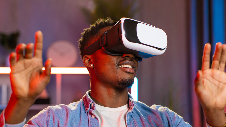 Wearing a VR headset.