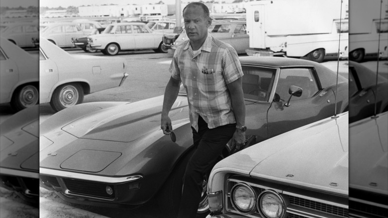 Buzz Aldrin walking from his parked Corvette