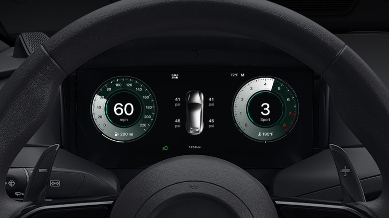 Close up of an Aston Martin dashboard featuring CarPlay Ultra displaying the driver's speed, tire pressure, and rpm.