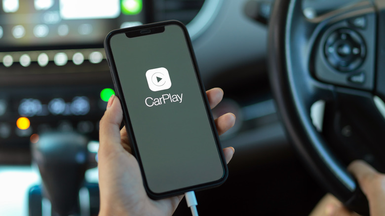 Someone using CarPlay in car