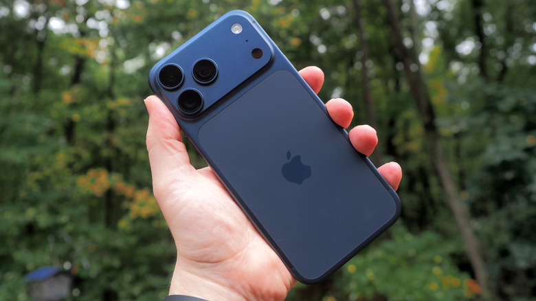Rear panel of blue Apple iPhone 17 Pro Max in hand