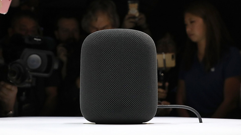 Journalists photographing original Apple HomePod