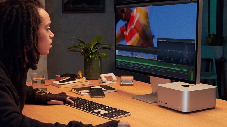 Person using Mac Studio and Studio Display
