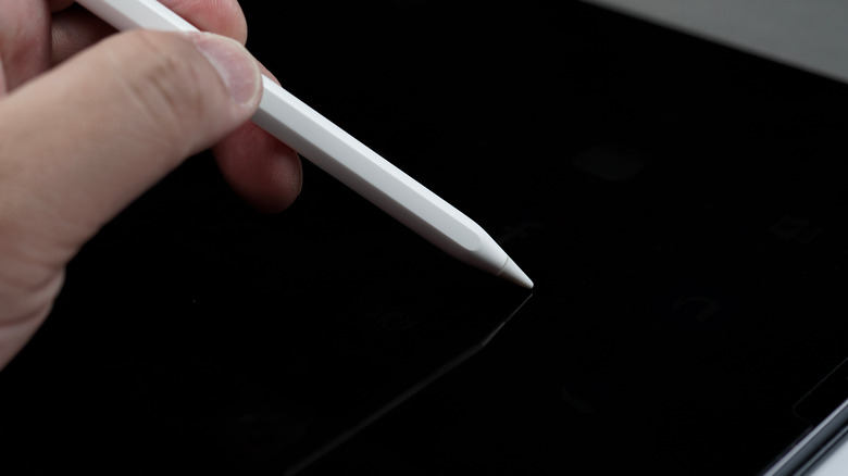 Apple Pencil held in hand