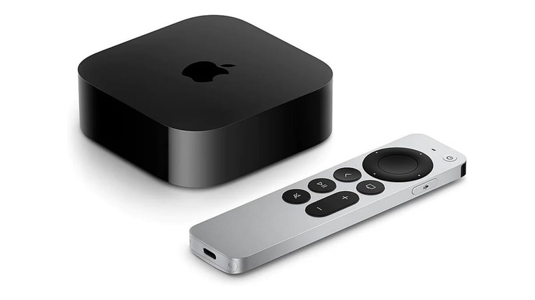 Apple TV 4K and remote on white background