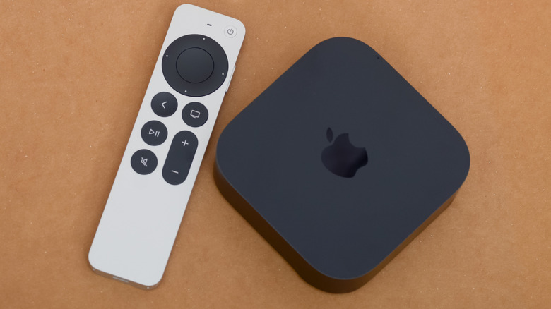 An Apple TV 4K box with the remote