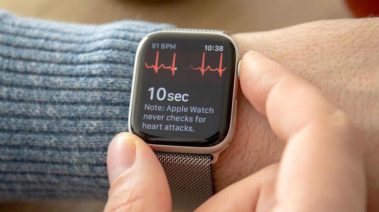 Person using the ECG feature on an older Apple Watch