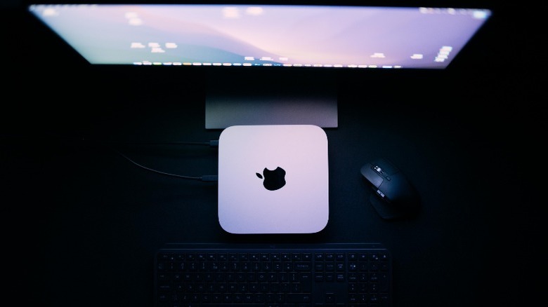 Mac Mini near desktop monitor, mouse, and keyboard