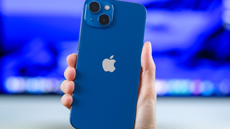 Blue iPhone held in hand