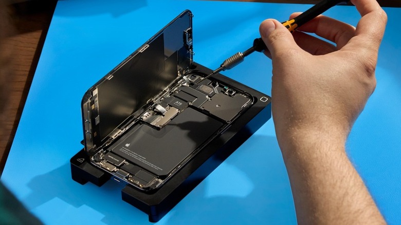An iPhone under repair.