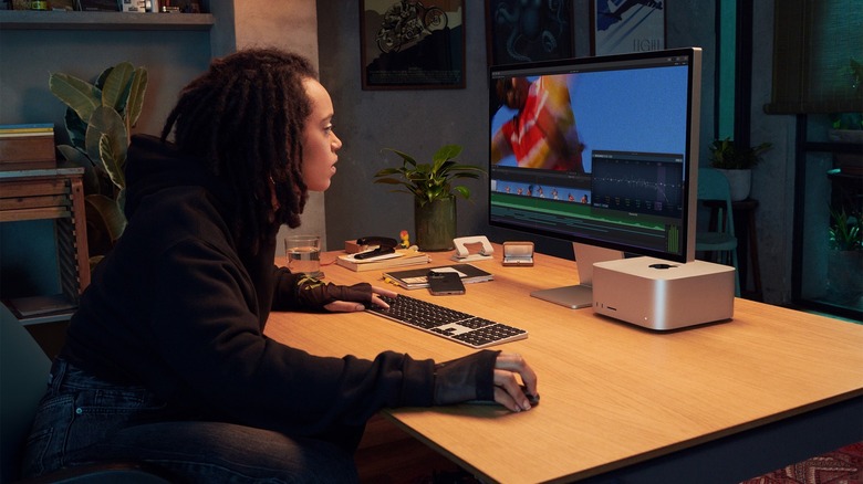 Woman using Apple Studio Display