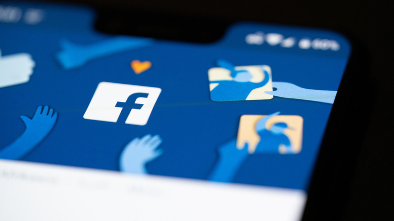 A close-up photograph of Facebook on a smartphone.