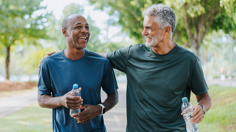 senior men walking in a park