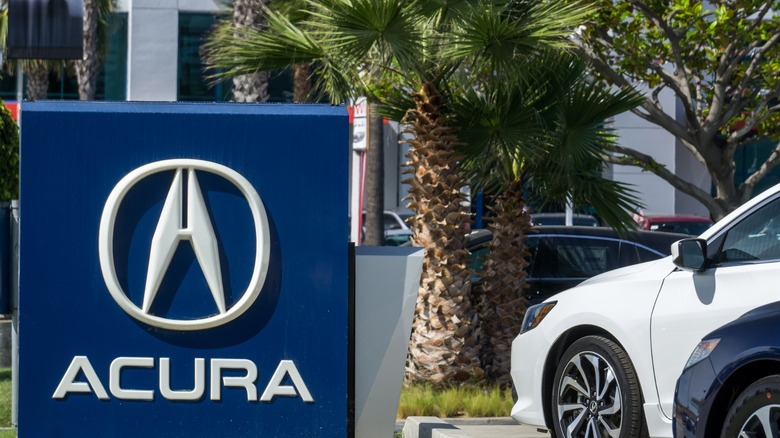 Front of Acura dealership with Acura logo