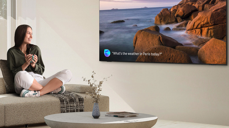 Woman looking at TV with Samsung Vision AI