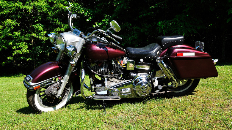 Maroon 1973 Harley-Davidson FLH Electra Glide with Shovelhead engine parked on grass