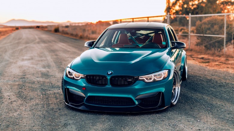 BMW M3 parked dirt road