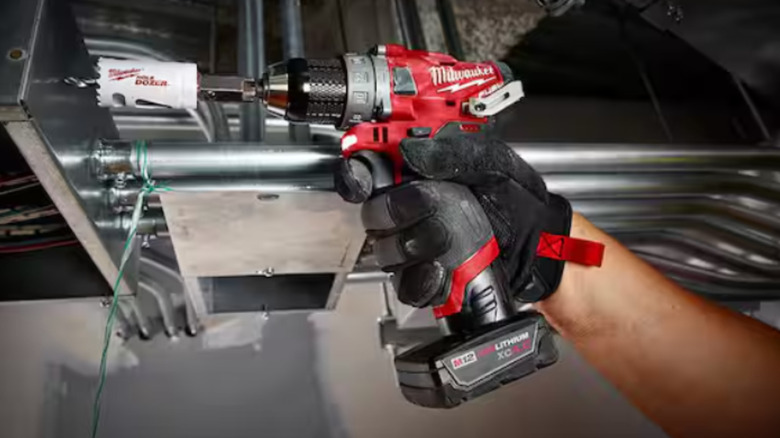 The Milwaukee M12 Fuel Hammer Drill drilling into metal