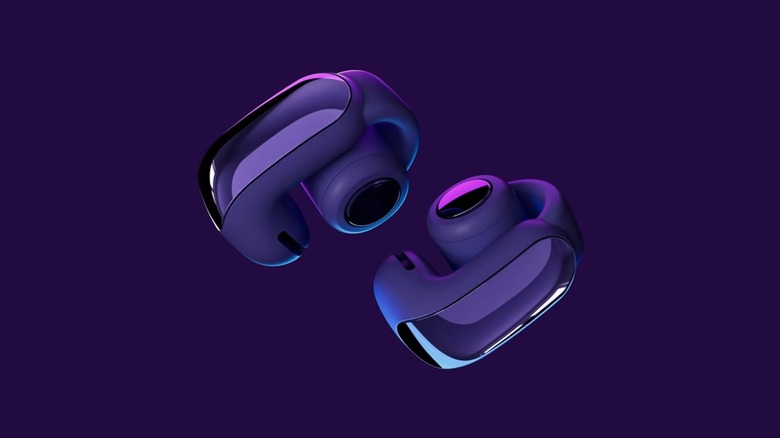 A pair of Bose Ultra Open Earbuds in midnight violet.