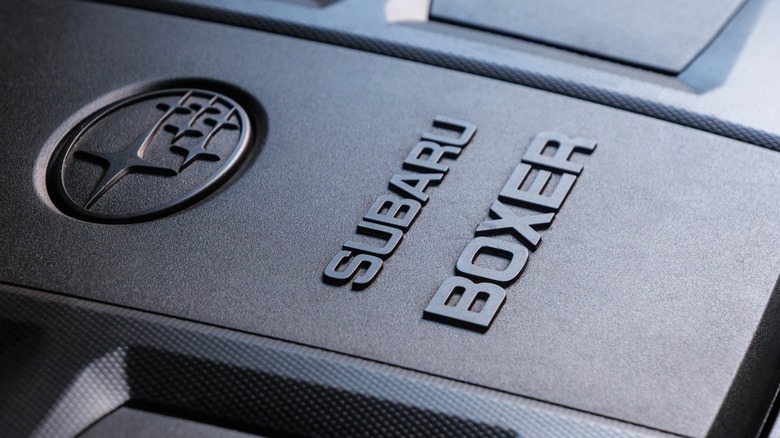 The plastic cover of a Subaru Boxer engine showing the Subaru constellation logo