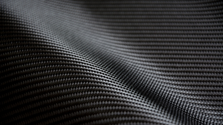 A close-up of raw carbon fiber composite