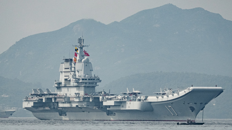 The PLA Navy's Shandong aircraft carrier docks in Hong Kong in July 2025.