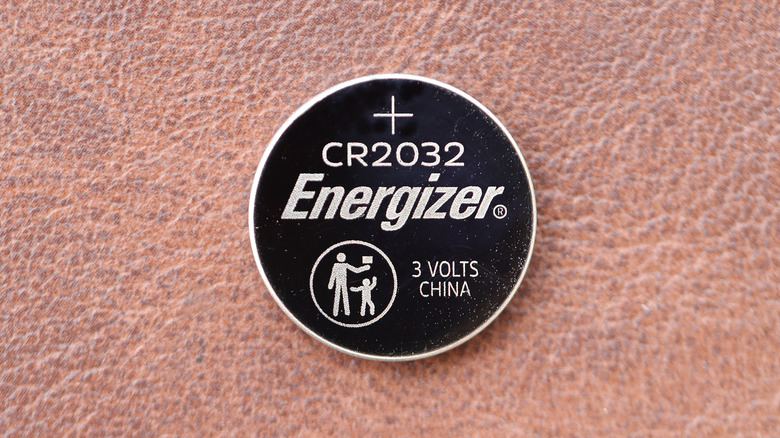 A closeup of a CR2032 battery