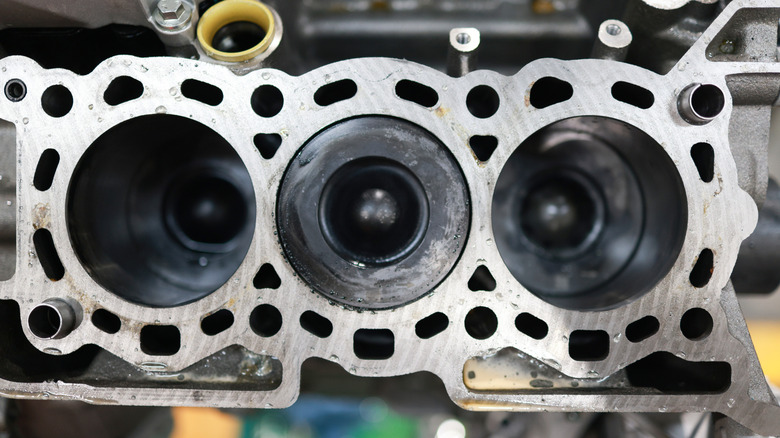 Top-down view of three-cylinder engine with cylinder head removed