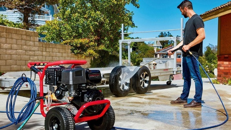Man using Predator pressure washer