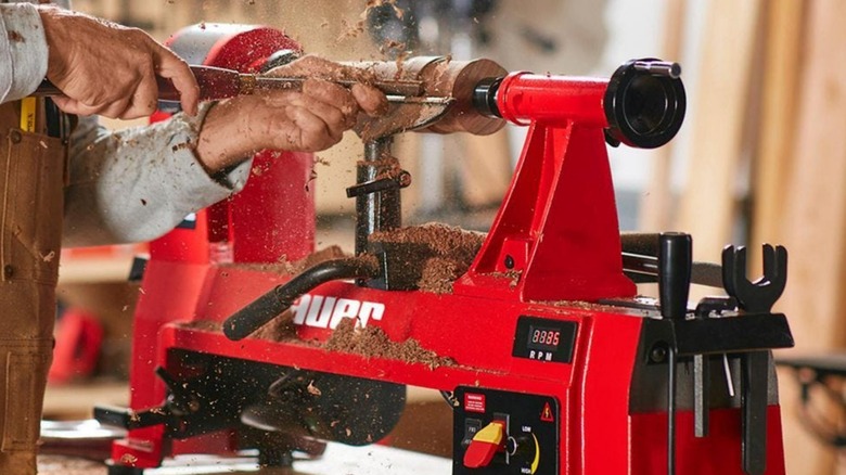 Carpenter turning wood on Bauer lathe
