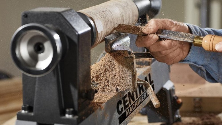 Carpenter turning wood on Central Machinery lathe