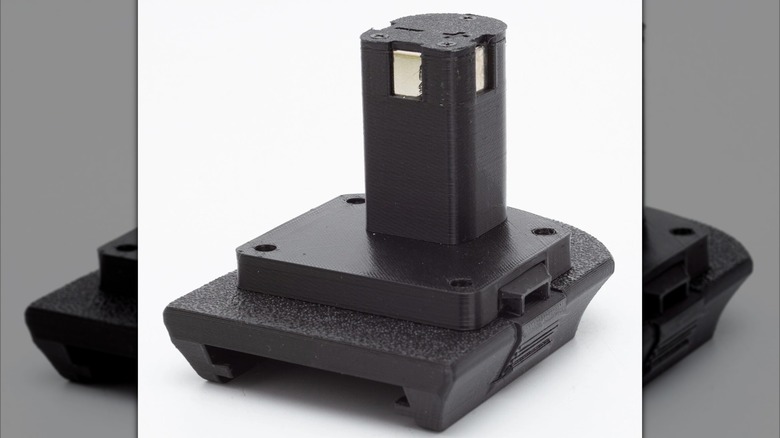 A Hart to Ryobi battery adapter on white background