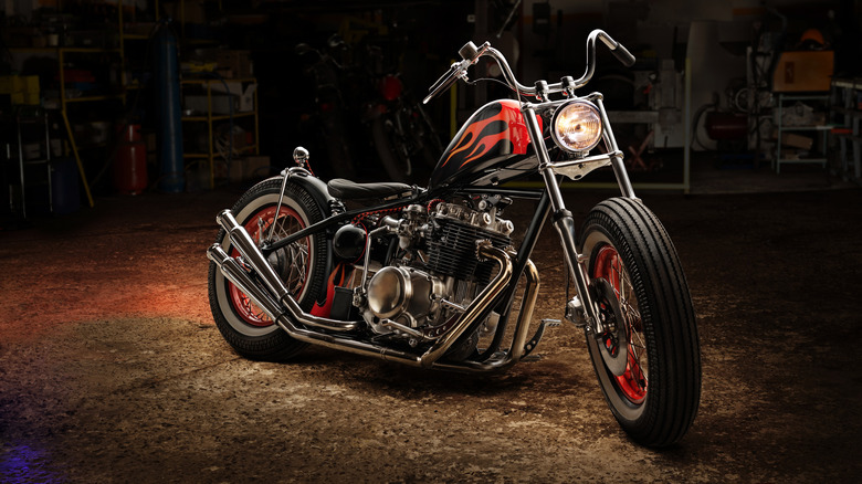 A vintage style custom bobber bike in a garage