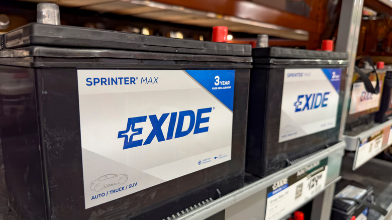Picture displaying Exide car batteries on a store shelf