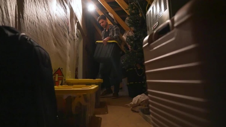 a person using home depot hdx plastic storage containers