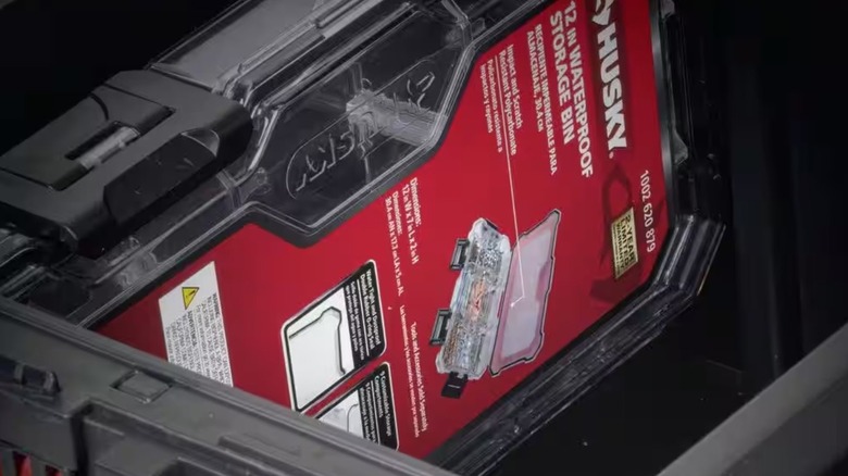 Picture displaying Husky 12" Storage bin inside of Build-Out box