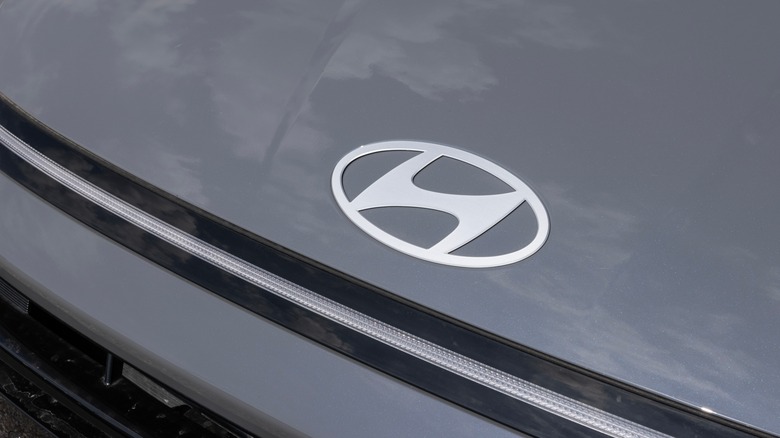 Close-up view of the Hyundai logo on the hood of a Hyundai car