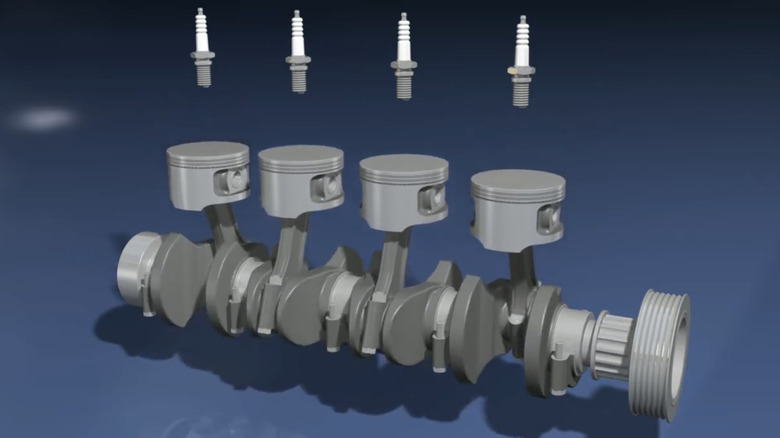 A 3D render of an inline four-cylinder engine, specifically pistons, spark plugs, and the crankshaft