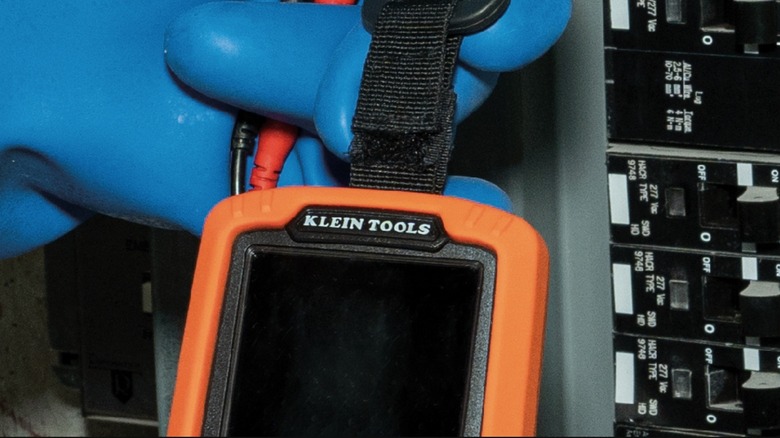 Person using Klein Tools Multimeter