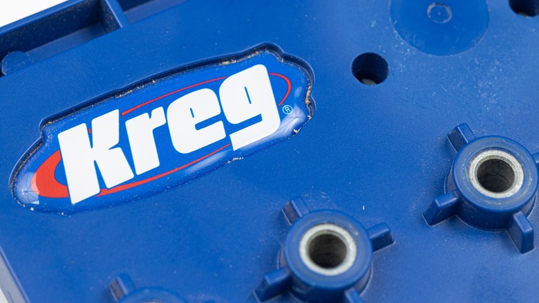 Large blue Kreg jig with a large Kreg logo on it