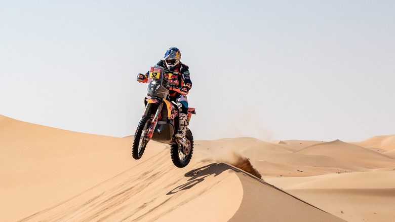 KTM 450 Rally Raid jumping over a dune