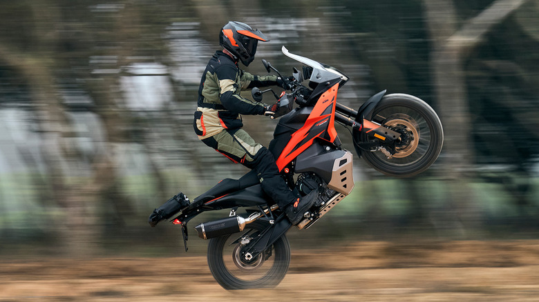 KTM 790 Adventure popping a wheelie on an offroad track