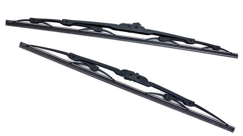 A pair of conventional, straight wiper blades and refills shown against a white background, one longer than the other.