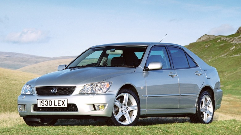 2001-2005 Lexus IS300 parked on grass with hills in the background