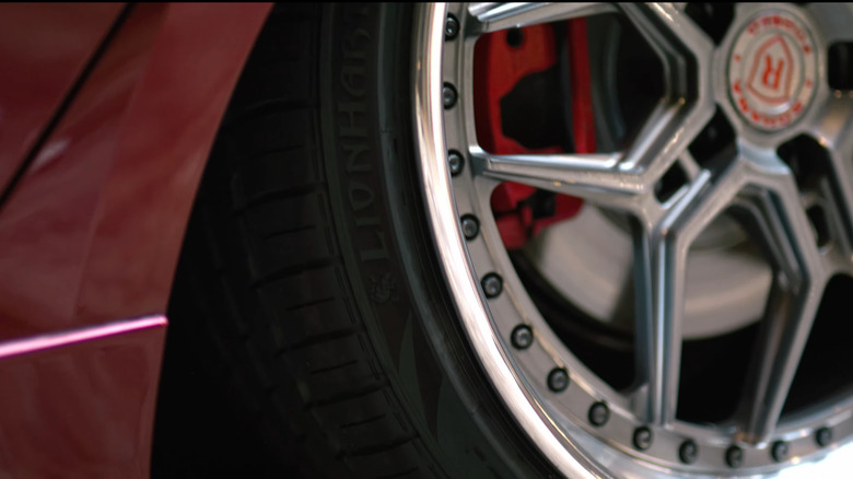 A close-up of the Lionhart branding on a tire, aftermarket wheels