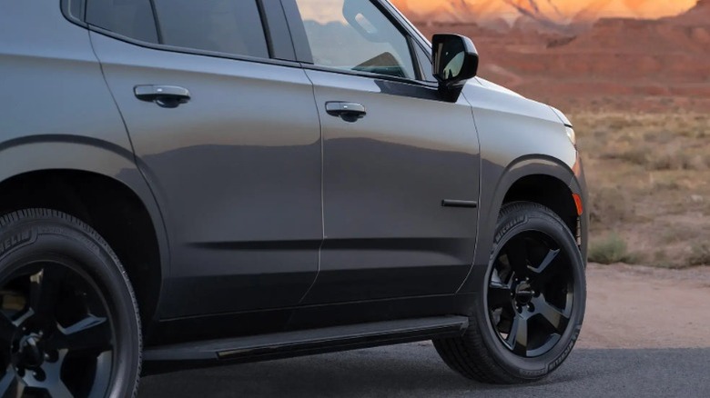 Gray SUV riding on Michelin Defender LTX M/S2 tires parked in a desert.