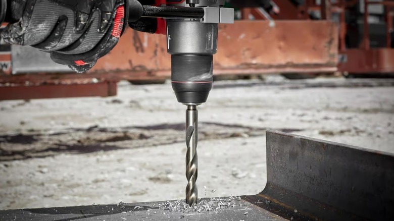 Milwaukee Cobalt drill bit drilling into metal