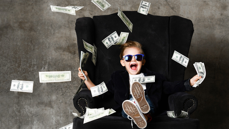 Kid throwing around cash